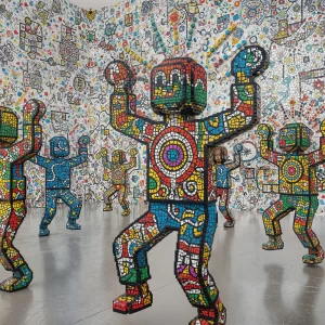 Lego-Haring dancers haloed with Aboriginal dots on cracked surface